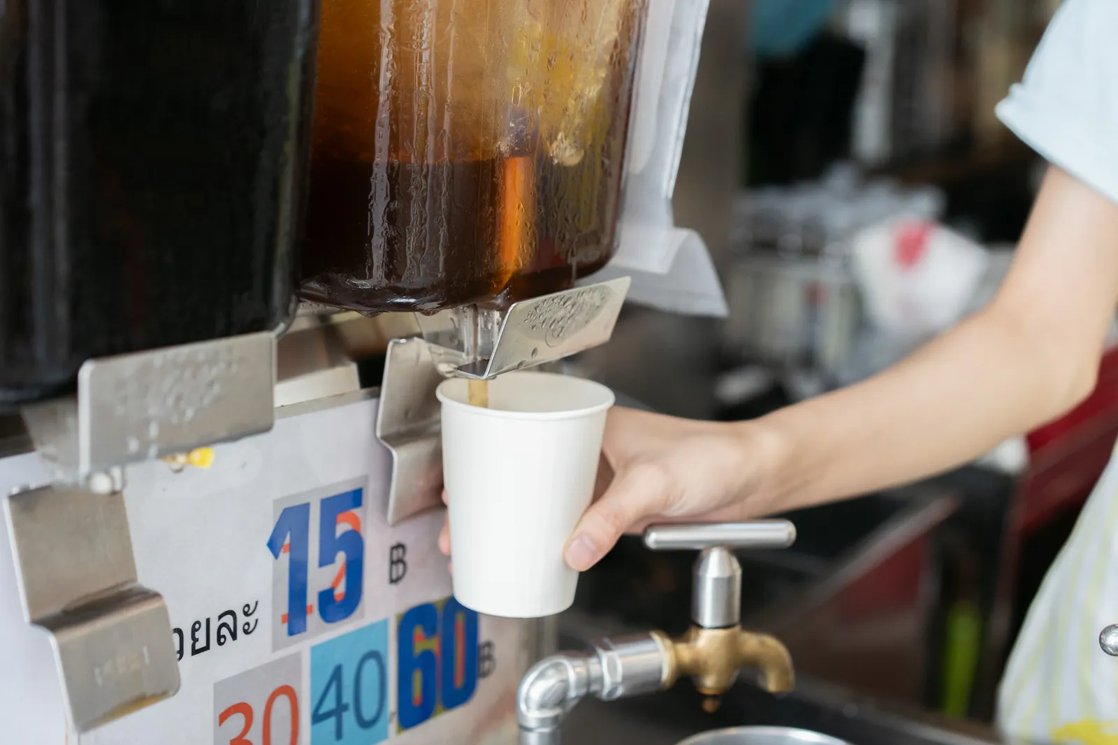Chinese herb drink from an old-school faucet