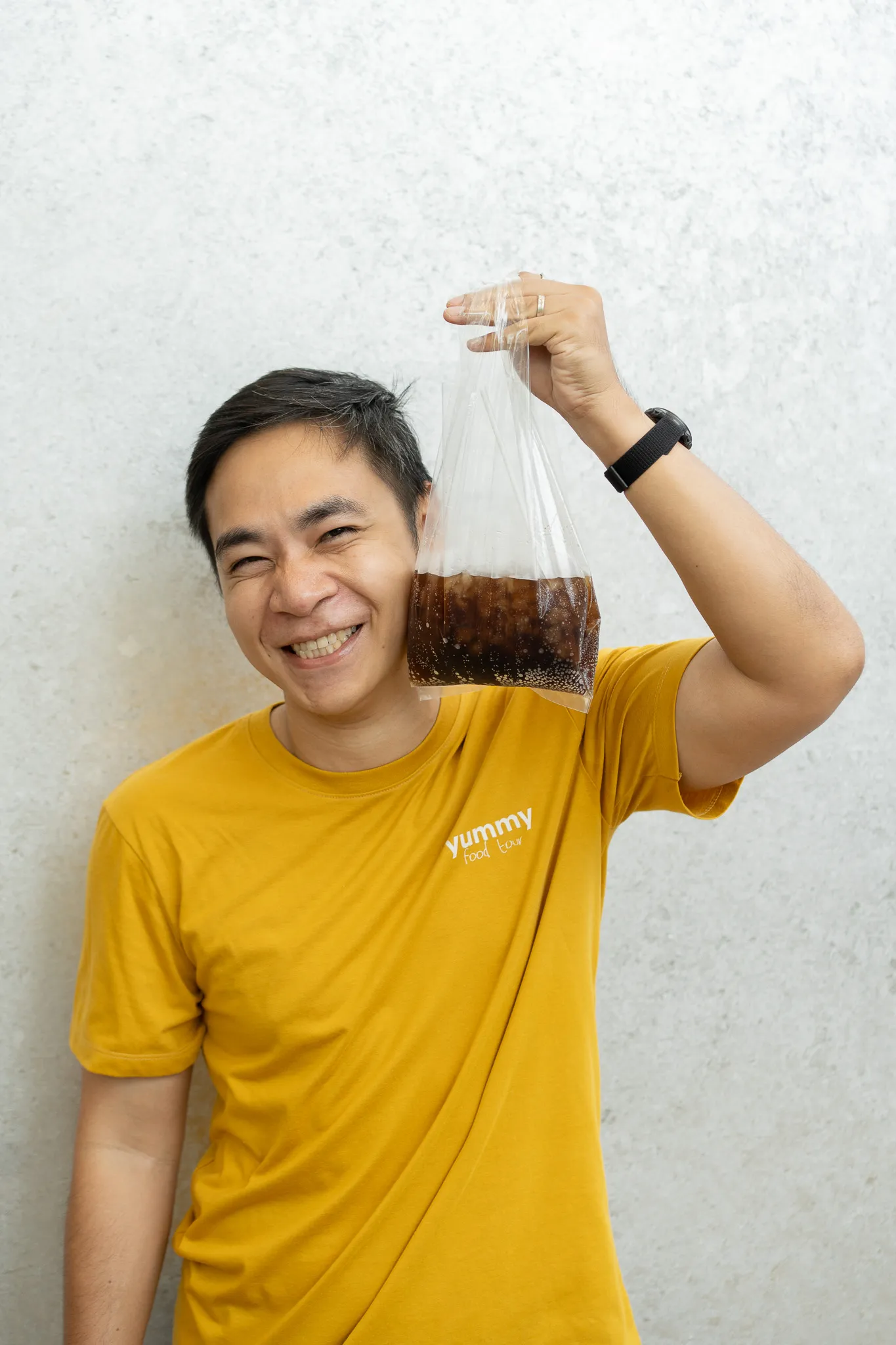 Tom holding a Thai iced drink